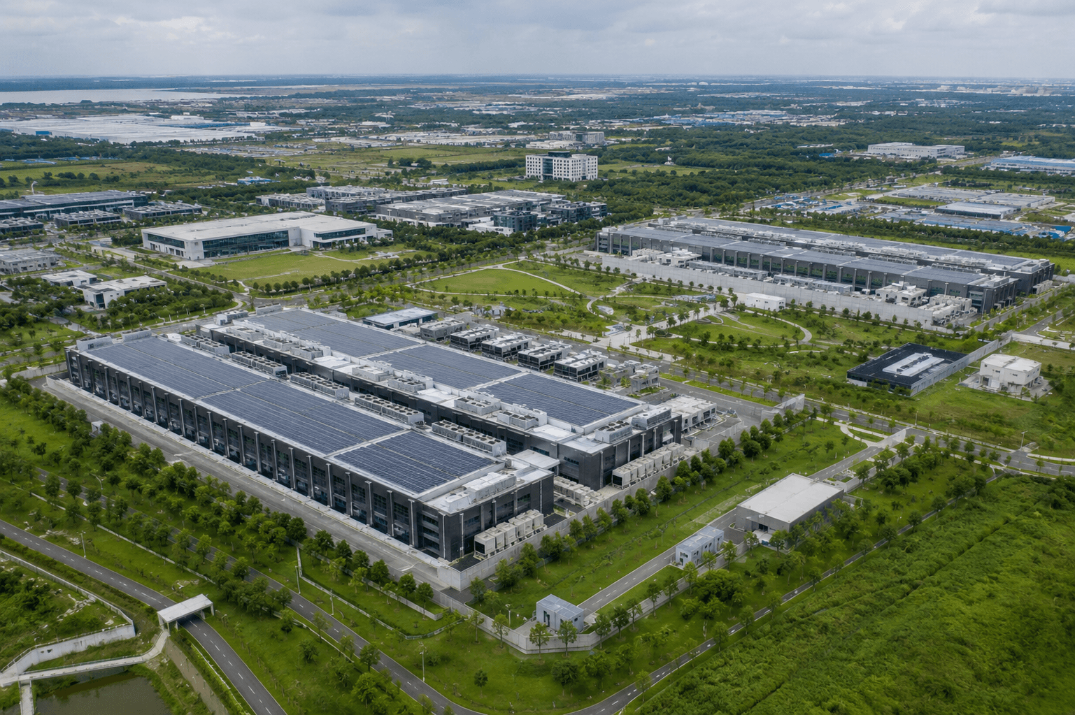 Aerial view of a green data centre campus with rooftop solar panels